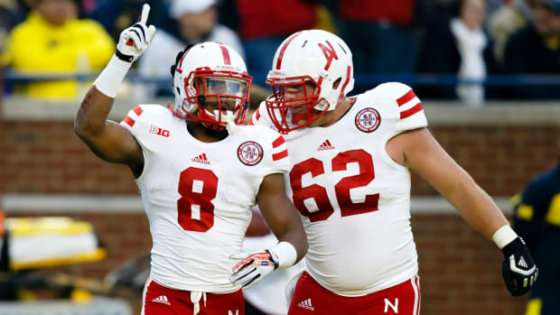 Ameer Abdullah and Cole Pensick 2013 Nebraska at Michigan football USATSI_7542612